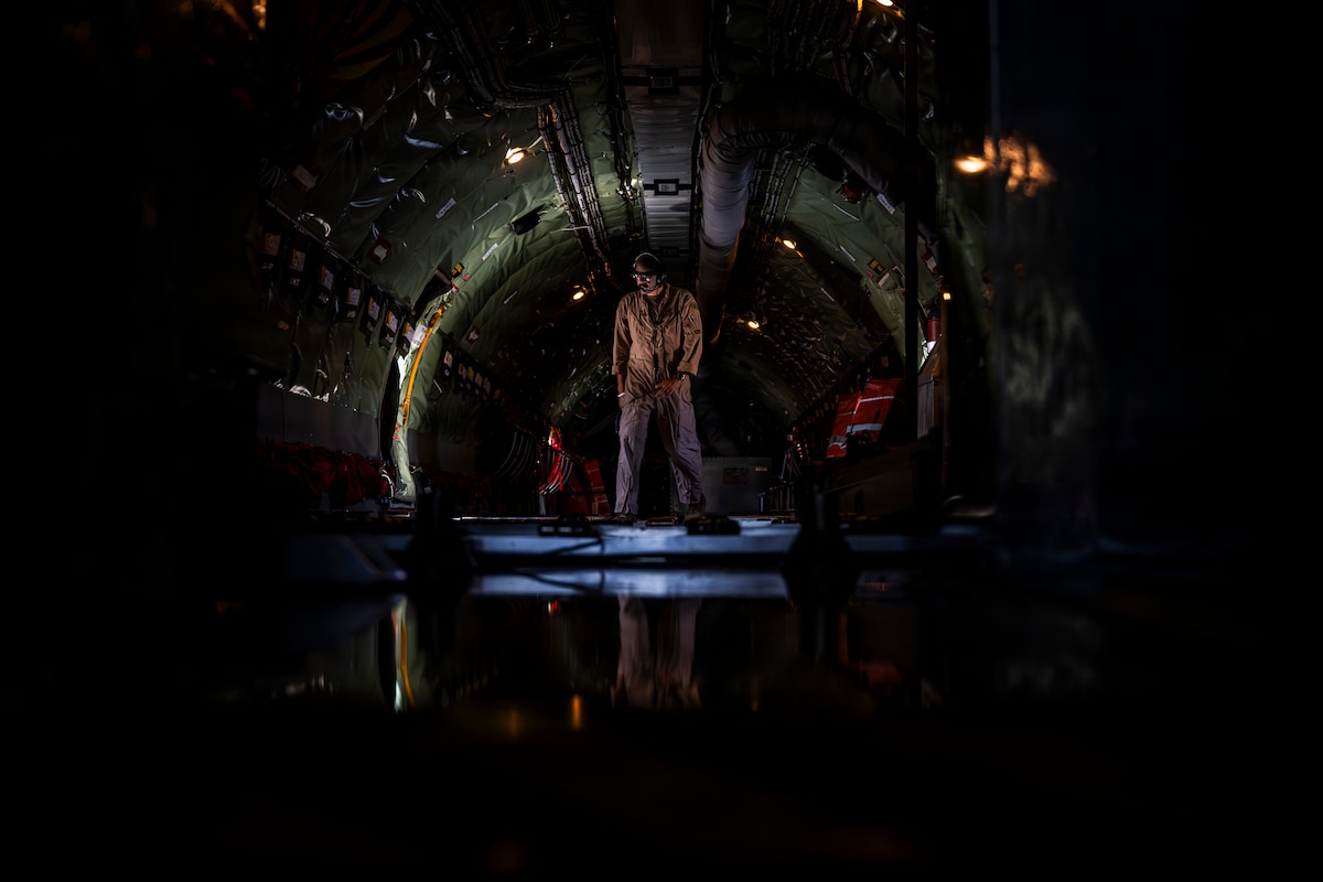 A U.S Air Force boom operator walks through the fuselage of a KC-135 Stratotanker at a base in the U.S. Central Command area of responsibility Aug. 25, 2026. Boom operators conduct aerial refueling operations that extend the range and endurance of aircraft supporting missions across the region. (U.S. Air Force photo by Senior Airman Adriana Jordan-Alcañiz)
