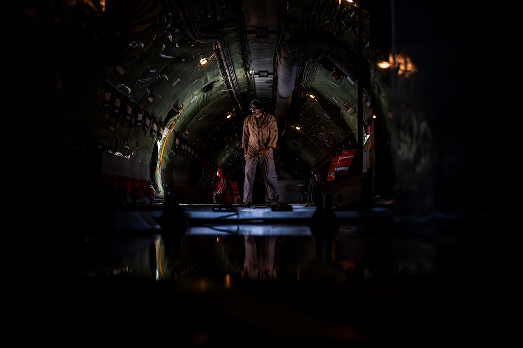 A U.S Air Force boom operator walks through the fuselage of a KC-135 Stratotanker at a base in the U.S. Central Command area of responsibility Aug. 25, 2026. Boom operators conduct aerial refueling operations that extend the range and endurance of aircraft supporting missions across the region. (U.S. Air Force photo by Senior Airman Adriana Jordan-Alcañiz)