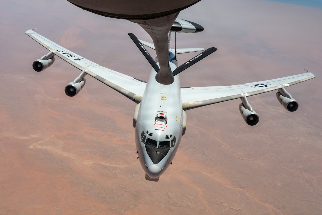 A U.S. Air Force E-3 Sentry approaches the boom of a KC-135 Stratotanker for midair refueling within the U.S. Central Command area of responsibility, Aug. 26, 2026. In-flight refueling sustains continuous airborne early warning, battle management, and command-and-control coverage throughout the theater. (U.S. Air Force photo by Tech. Sgt. Tiffany A. Emery)