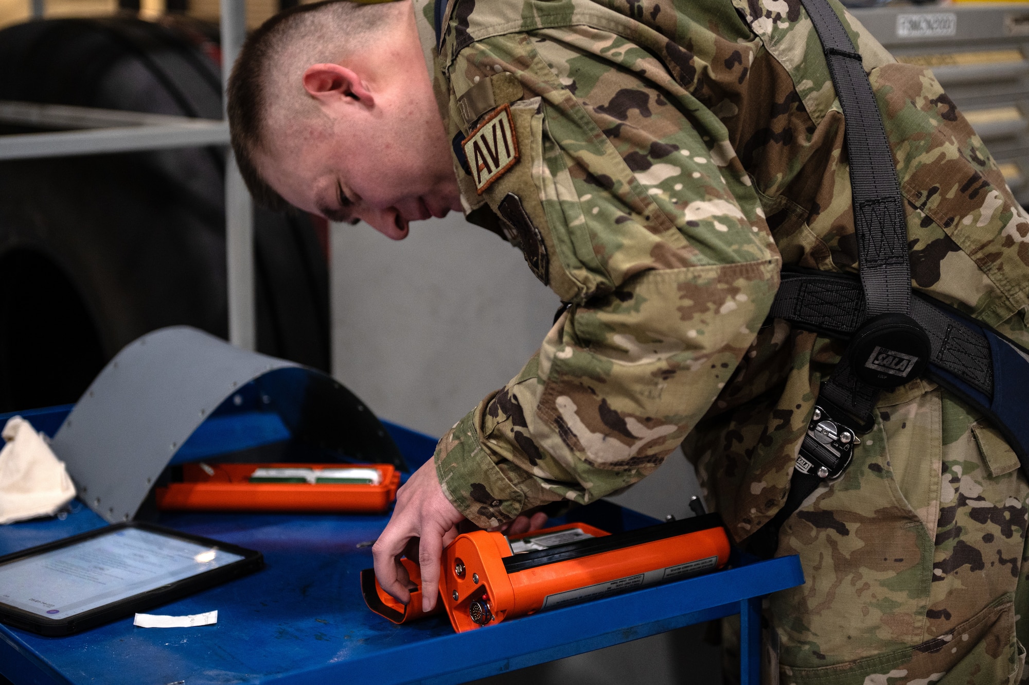 U.S. Air Force Tech. Sgt. Collin Crocker, 133rd Maintenance Squadron, examines the Emergency Transmitter Locator System from a C-130 Hercules in St. Paul, Minn., April 11, 2026.