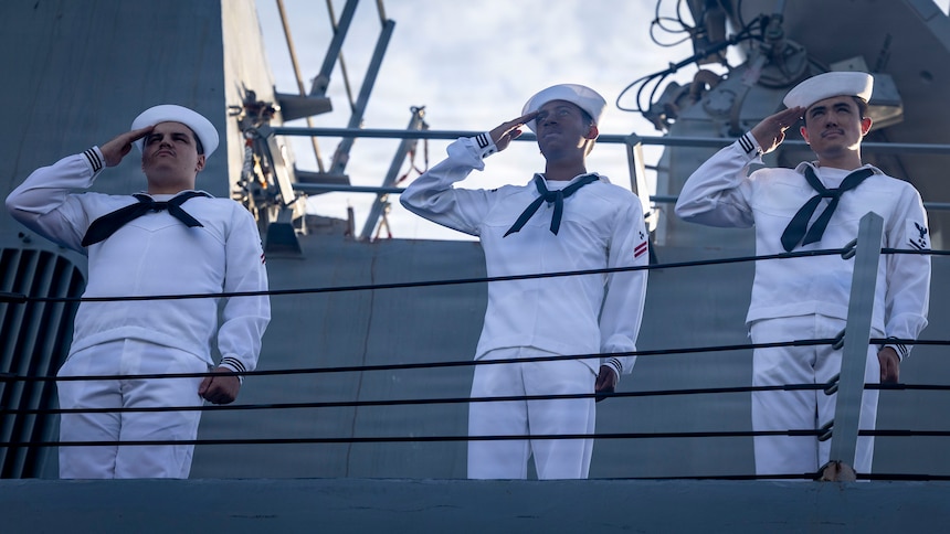 Sailors aboard the Arleigh Burke-class guided-missile destroyer USS Jason Dunham (DDG 109) salute the national ensign during morning colors before departing Naval Station Mayport to begin operations in support of its scheduled deployment, Aug. 28, 2026. Jason Dunham is a multi-mission surface combatant capable of conducting anti-air, anti-submarine, and anti-surface warfare operations.