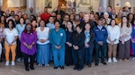 Many of ATAMMC’s original staff, “plank owners”, pose for a photo honoring 15 years of a Culture of Excellence.