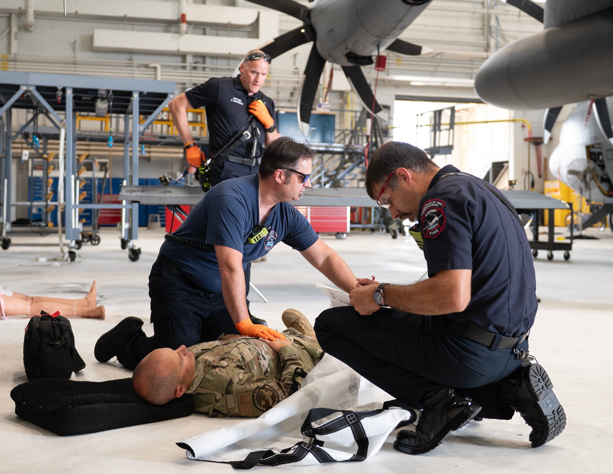 Firefighters from the Minneapolis-Saint Paul International Airport’s Fire Department assess role-player injuries in St. Paul, Minn., July 20, 2026.