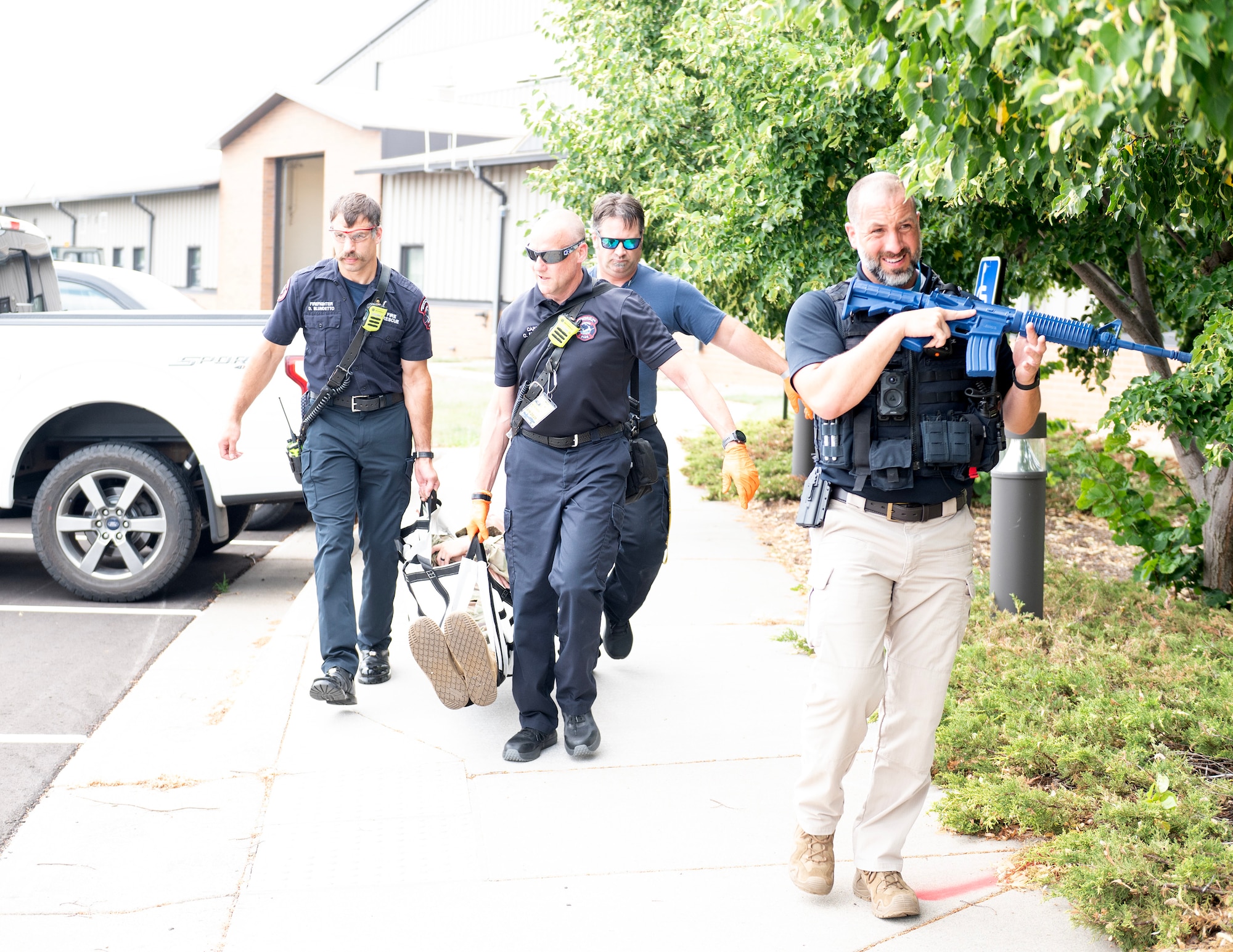 A police officer from the Minneapolis-Saint Paul International Airport’s Police Department provides security for firefighters in St. Paul, Minn., July 20, 2026.