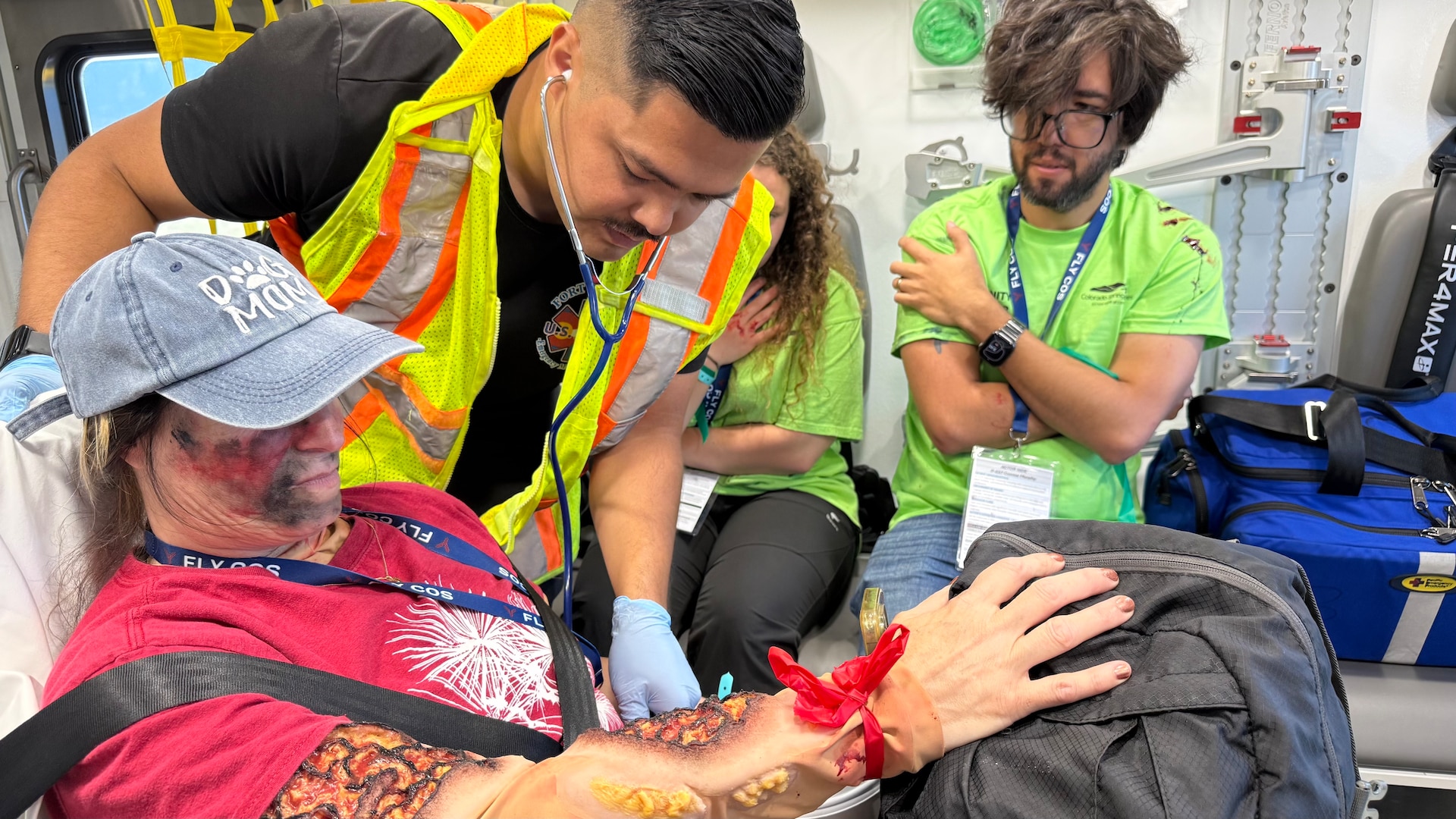 Private 1st Class Oziel Lara, a 68w Combat Medic assigned to the Evans Army Community Hospital Department of Emergency Services, checks vita signs of an exercise casualty volunteer during a full-scale Mass Casualty exercise simulating a commercial aircraft crash at the Colorado Springs Airport Aug. 19, 2026.