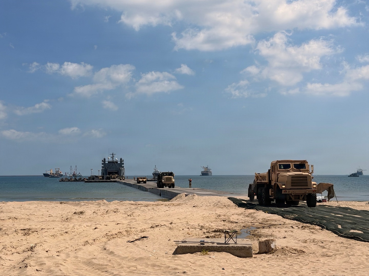 A U.S. Army temporary pier system enables shiptoshore offloading and provides a mooring point for U.S. Coast Guard Port Security Unit 309’s 32foot Transportable Port Security Boats at Yeongil Bay, Pohang, South Korea, during Combined Joint Logistics OvertheShore (CJLOTS) 26, July 13, 2026. Conducted under the 1953 ROKU.S. Mutual Defense Treaty, CJLOTS 26 strengthens the Alliance’s commitment to regional peace and security. (U.S. Coast Guard photo by Lt. Ashlee Stephens)