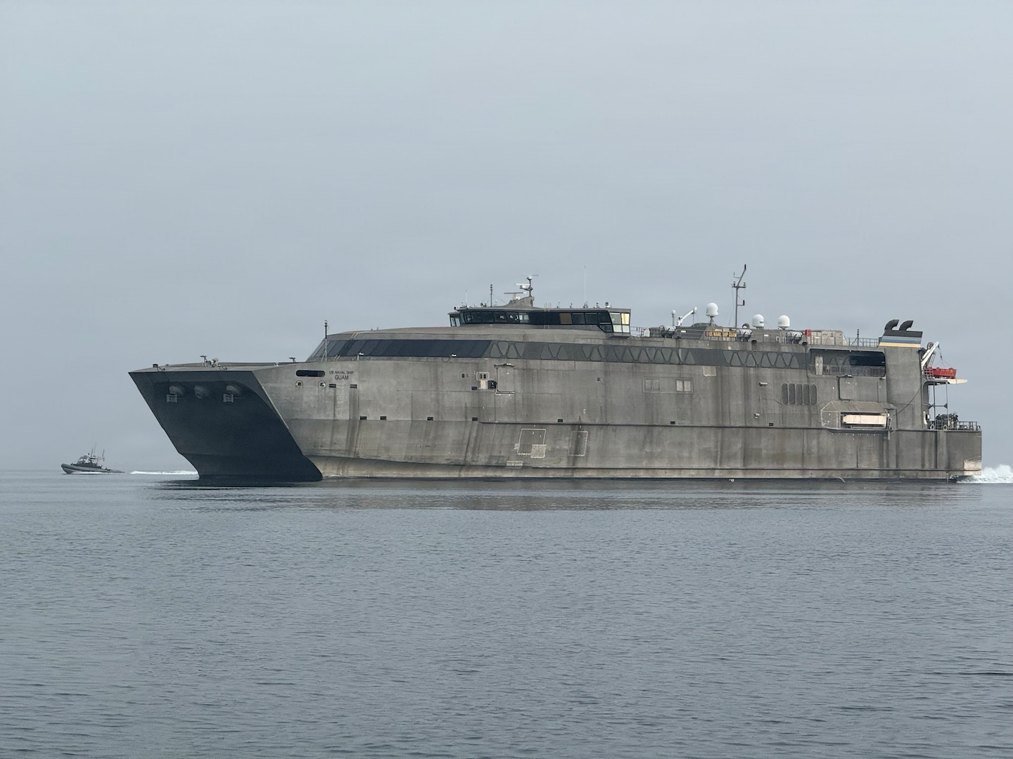 A 32-foot Transportable Port Security Boat from U.S. Coast Guard Port Security Unit (PSU) 309 escorts the USNS GUAM as the ship enters the Port of Pohang during Combined Joint Logistics Over-the-Shore (CJLOTS) 26 in Pohang, South Korea, July 18, 2026. PSUs train to rapidly deploy worldwide to protect U.S. interests and assets, including ports, facilities, and designated naval and maritime administration vessels. (U.S. Coast Guard photo by Chief Petty Officer Andrew Resk)
