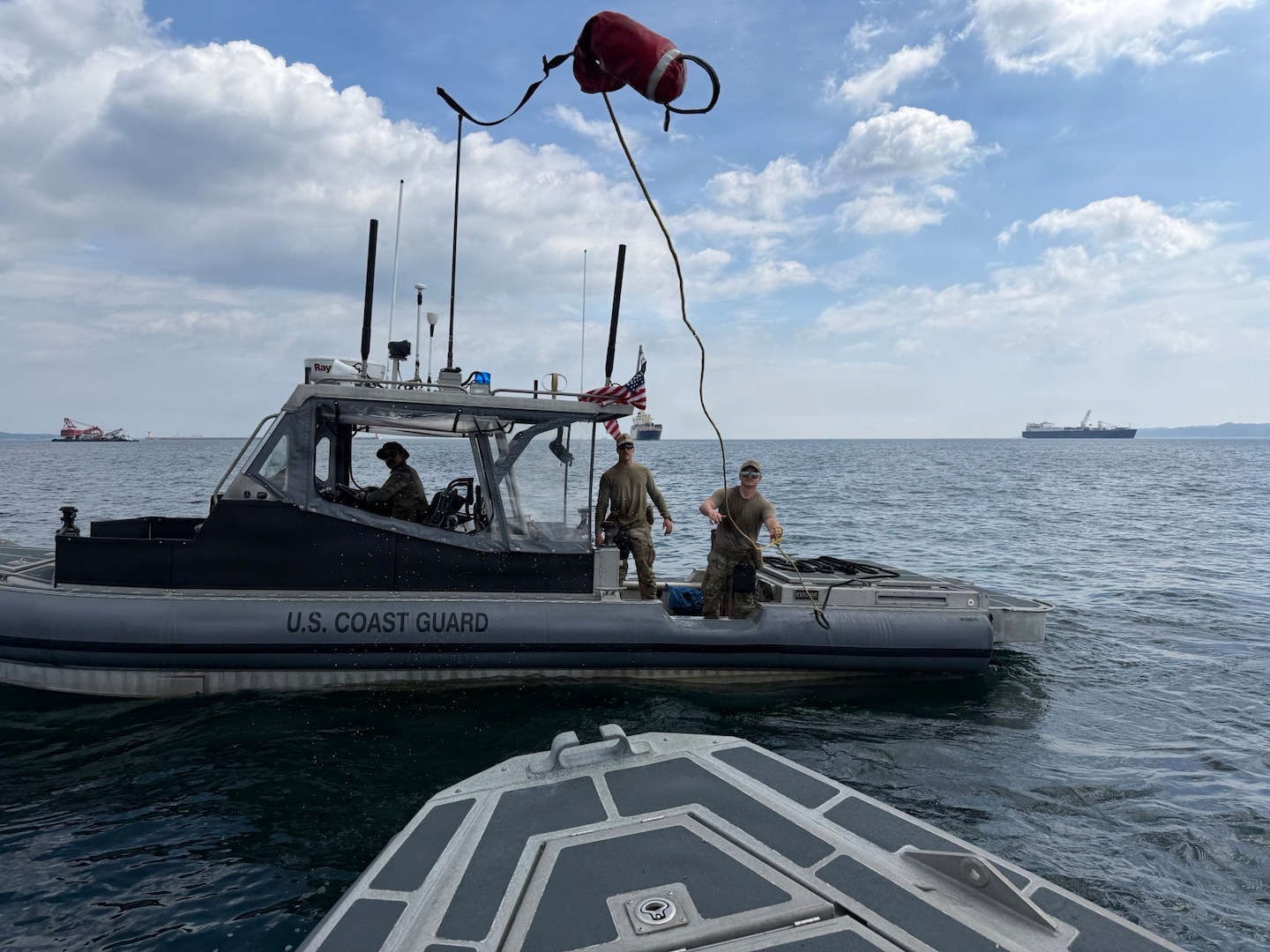 Members of U.S. Coast Guard Port Security Unit (PSU) 309 conduct training aboard 32-foot Transportable Port Security Boats during Combined Joint Logistics Over-the-Shore (CJLOTS) 26 in Pohang, South Korea, July 9, 2026. PSUs train to rapidly deploy worldwide to protect U.S. interests and assets, including ports, facilities, and designated naval and maritime administration vessels. (U.S. Coast Guard photo by Chief Petty Officer Andrew Resk)