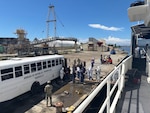 Crewmembers aboard the Coast Guard Cutter Joseph Doyle repatriate and transfer 75 migrants to Dominican Republic Navy authorities in San Pedro de Macorís, Dominican Republic, Sept. 4, 2026. The crew interdicted the group on Sept. 2, 2026, after intercepting a grossly overloaded makeshift boat in the Mona Passage off the coast of Puerto Rico. (U.S. Coast Guard photo)