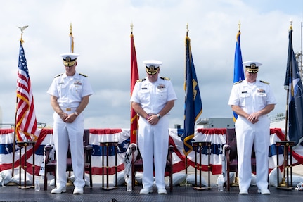 From left to right, U.S. Navy Rear Adm. Peter D. Small, the acting commander for Naval Sea Systems Command, Capt. Joseph J. Oravec, the outgoing commanding officer for Naval Surface Warfare Center Dahlgren Division and Capt. Jason A. Flanagan, the incoming commanding officer, bow their heads during a change of command ceremony at NSWCDD, Dahlgren, Virginia, Sept. 3, 2026. The change of command ceremony is a time-honored tradition which formally signifies the transfer of command and entails total accountability, authority and responsibility from one individual to another. (NSWCDD photo by Jackson Rush)