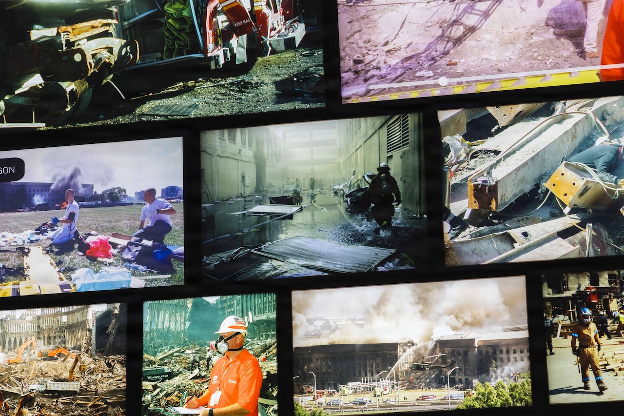 TV screens of different sizes show images from the aftermath of 9/11.