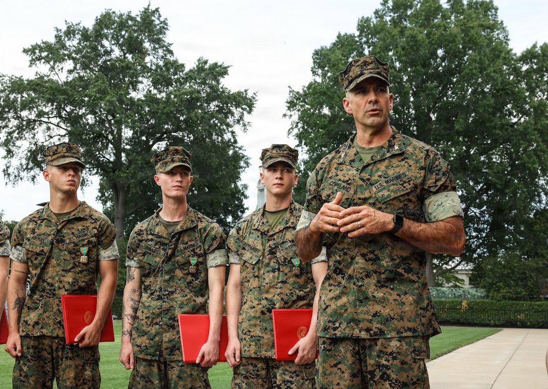 U.S. Marine Corps Col. Jason Copeland, commanding officer of Marine Barracks Washington, right, speaks to Guard Company after awarding Marines the Navy and Marine Corps Achievement Medal during an award ceremony at Marine Barracks Washington, D.C., Sept. 3, 2026. The Marines were awarded for their decisive actions as part of a reaction team that safely neutralized an armed threat on the installation. (U.S. Marine Corps photo by Cpl. Brynn L. Bouchard)