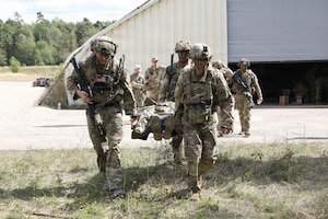 Soldiers with 3rd Battalion, 504th Parachute Infantry Regiment, 173rd Mobile Brigade Combat Team (Airborne), transport Soldiers with simulated injuries following an attack during exercise Saber Junction 26 at Joint Multinational Readiness Center's Hohenfels Training Area, Germany, Aug. 30, 2026. JMRC's Combat Training Center rotations drive unrivaled innovation and readiness in the U.S. Army Europe and Africa area of operations. (U.S. Army photo by Staff Sgt. Justin Martin)