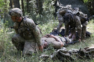 Soldiers with 3rd Battalion, 504th Parachute Infantry Regiment, 173rd Mobile Brigade Combat Team (Airborne), prepare to transport a Soldier with simulated injuries during exercise Saber Junction 26 at Joint Multinational Readiness Center's Hohenfels Training Area, Germany, Aug. 30, 2026. The Continuous Transformation initiative is grounded in one principle: increasing the lethality of U.S. Army formations by creating more agile and mobile units capable of responding to complex combat scenarios. (U.S. Army photo by Staff Sgt. Justin Martin)