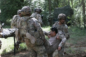 Soldiers with 3rd Battalion, 504th Parachute Infantry Regiment, 173rd Mobile Brigade Combat Team (Airborne), transport Soldiers with simulated injuries following an attack during exercise Saber Junction 26 at Joint Multinational Readiness Center's Hohenfels Training Area, Germany, Aug. 30, 2026. The Continuous Transformation initiative is grounded in one principle: increasing the lethality of U.S. Army formations by creating more agile and mobile units capable of responding to complex combat scenarios. (U.S. Army photo by Staff Sgt. Justin Martin)