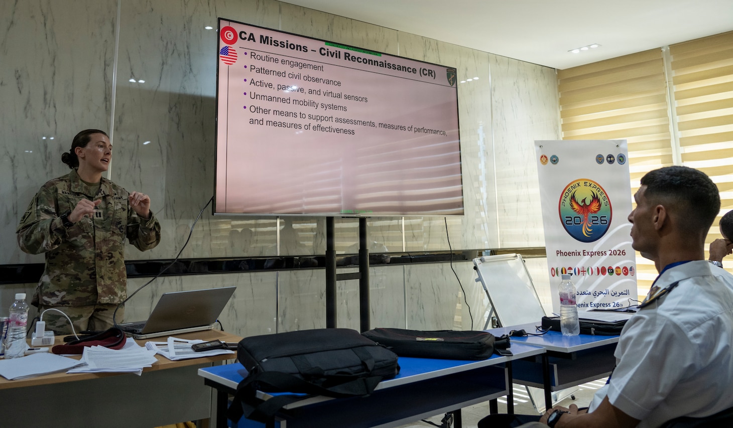 U.S. Army Capt. Brittany Manquen, 412th Civil Affairs Battalion, Bravo Company, Civil Affairs Team 1223, delivers a civil affairs training to combined military personnel during exercise Phoenix Express 2026 at the Port of La Goulette, Tunisia, Sept. 7, 2026. Phoenix Express 2026 is a multinational maritime exercise sponsored by U.S. Africa Command and led by U.S. 6th Fleet under U.S. Naval Forces Africa, bringing together North African, European and U.S. maritime forces as part of a global network of navies to enhance cooperation and expertise in maritime security operations in the southern Mediterranean Sea. (U.S. Navy Photo by Mass Communication Specialist 1st Class Austin Ingram)