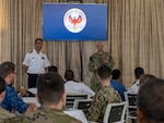 U.S. Navy Capt. Harish Patel, right, U.S. exercise director of Phoenix Express 2026, and Tunisian Navy Commodore Rejeb Gara Ali, exercise director for Tunisia, address combined military personnel during an opening briefing for the exercise at the Port of La Goulette, Tunisia, Sept. 7, 2026. Phoenix Express 2026 is a multinational maritime exercise sponsored by U.S. Africa Command and led by U.S. 6th Fleet under U.S. Naval Forces Africa, bringing together North African, European and U.S. maritime forces as part of a global network of navies to enhance cooperation and expertise in maritime security operations in the southern Mediterranean Sea. (U.S. Navy Photo by Mass Communication Specialist 1st Class Austin Ingram)
