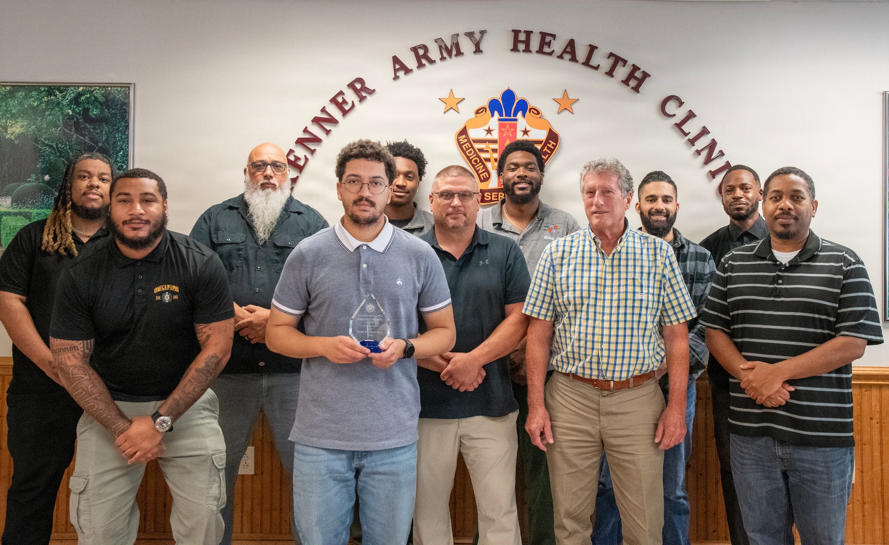 Members of Kenner Army Health Clinic’s Information Management Division (IMD) pose with the Defense Health Agency Auditability Compliance Award at Fort Lee,