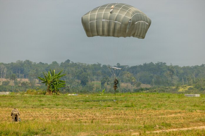 A U.S. Soldier assigned to 1st Battalion, 501st Parachute Infantry Regiment, 2nd Brigade Combat Team (Airborne), 11th Airborne Division, lands in the drop zone after a multinational airborne jump during Super Garuda Shield 26 at Baturaja Combat Training Center, Indonesia, Sept. 4, 2026.