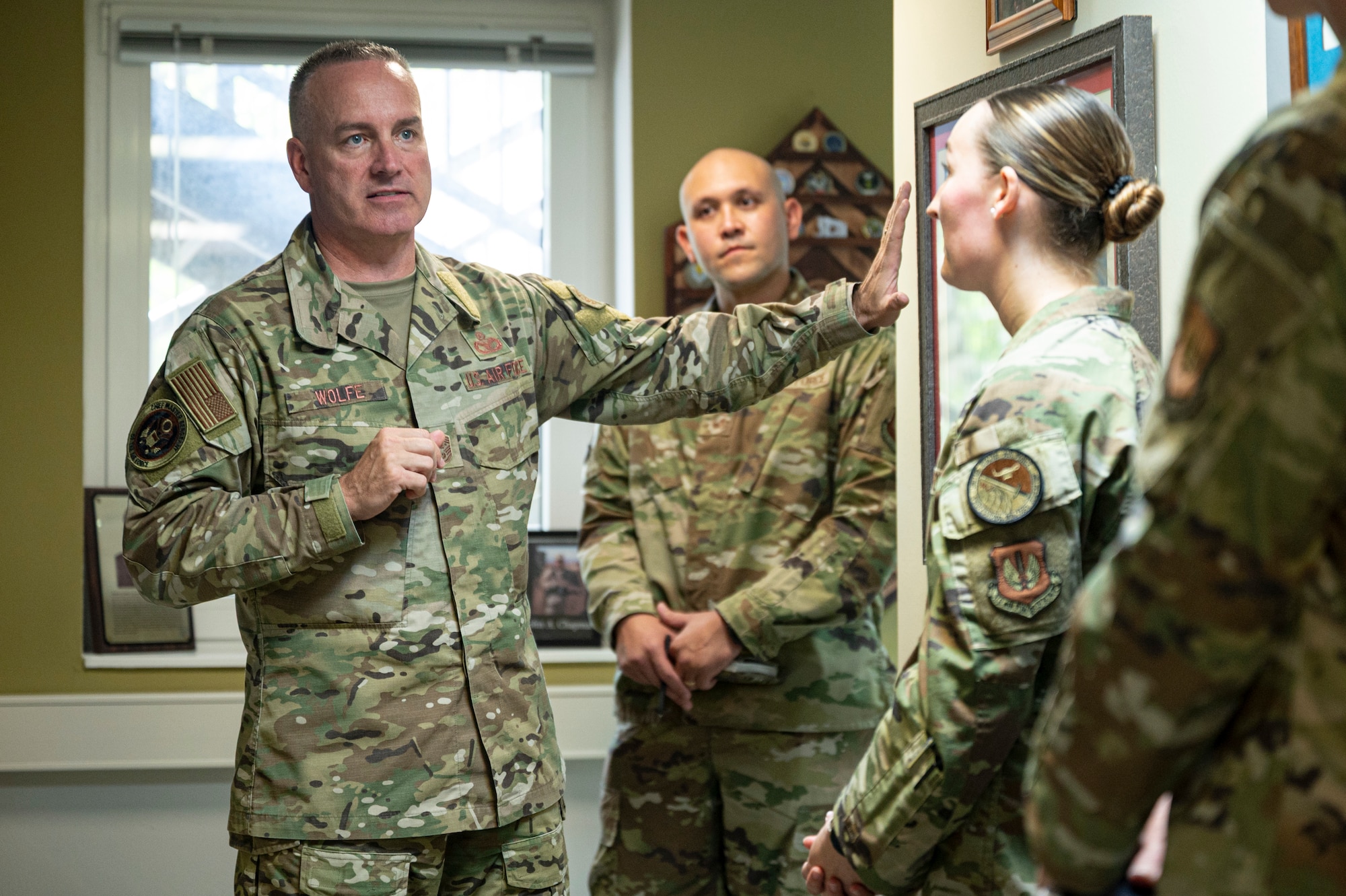 Chief Master Sergeant of the Air Force David Wolfe, right, speaks with Pitsenbarger Airman Leadership School cadres during a base visit.