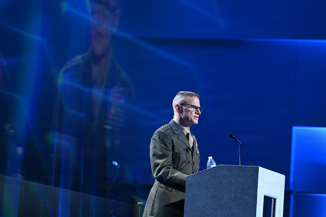 Photo of Lt. Gen. James Adams standing at a podium during DoDIIS Worldwide, 2026.