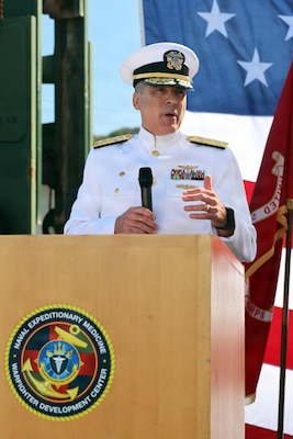 Rear Adm. Kevin Brown, commander of Naval Medical Forces Pacific, delivers his remarks during the Naval Expeditionary Medicine Warfighter Development Center change of command ceremony aboard Marine Corps Base Camp Pendleton, California, Sept. 3, 2026. Brown praised the command for standardizing realistic, high-fidelity trauma and en-route care training in support of warfighter survivability and joint force lethality. (U.S. Navy photo by Arsenio R. Cortez Jr.)