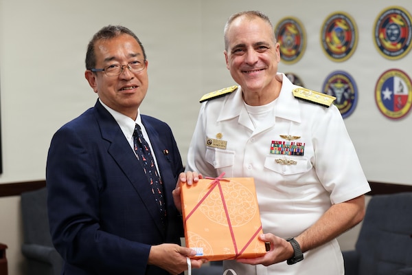 Jun Tsushima, state minister of the Cabinet Office of Japan, presents a token of appreciation to Rear Adm. Kevin Brown, commander of Naval Medical Forces Pacific, in San Diego, Aug. 25, 2026. Tsushima led a senior delegation of Japanese government officials, clinical leaders, and academic researchers to observe operational requirements for maritime health care in the Indo-Pacific. (U.S. Navy photo by Arsenio R. Cortez Jr.)