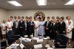 Leadership from Naval Medical Forces Pacific and members of a visiting Japanese health care delegation pose for a group photo at NMFP headquarters in San Diego, Aug. 25, 2026. The bilateral engagement brought together military medical leaders, government officials, and academic researchers to deepen cooperation in maritime medicine and hospital ship operations. (U.S. Navy photo by Arsenio R. Cortez Jr.)