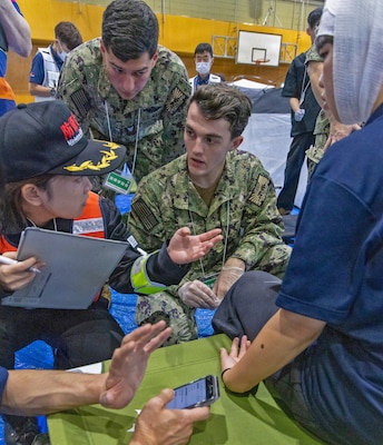 ATSUGI, Japan (Sept. 1, 2026) — U.S. Navy Sailors assigned to U.S. Navy Medicine Readiness and Training Unit (USNMRTU) Atsugi coordinate with a Japanese emergency responder during Big Rescue Kanagawa 2026 at the Kanagawa Prefectural Comprehensive Disaster Prevention Center and Fire Academy. Big Rescue Kanagawa is a large-scale, multi-agency disaster-response exercise jointly organized by Kanagawa Prefecture and Atsugi City to rehearse patient reception, bilateral triage, and emergency response operations. (U.S. Navy photo by Daniel Taylor/USNMRTC Yokosuka Public Affairs)