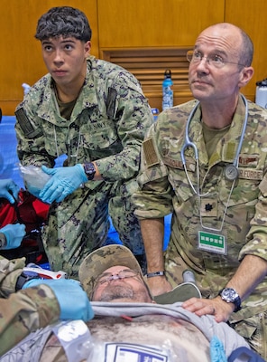 ATSUGI, Japan (Sept. 1, 2026) — A U.S. Air Force medical officer, center right, works alongside U.S. Navy Sailors to provide care during Big Rescue Kanagawa 2026 at the Kanagawa Prefectural Comprehensive Disaster Prevention Center and Fire Academy. Big Rescue Kanagawa is a large-scale, multi-agency disaster-response exercise jointly organized by Kanagawa Prefecture and Atsugi City to rehearse patient reception, bilateral triage, and emergency response operations. (U.S. Navy photo by Daniel Taylor/USNMRTC Yokosuka Public Affairs)