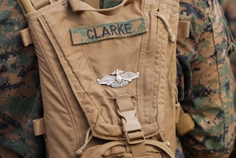 NAVAL STATION GUANTANAMO BAY, Cuba (Aug. 26, 2026) — The Fleet Marine Force enlisted warfare specialist device worn by U.S. Navy Hospital Corpsman 3rd Class Cameron Alexander Clarke, assigned to Joint Task Force-Southern Guard’s Task Force Secure, is displayed during a training evolution at Naval Station Guantanamo Bay, Cuba. Clarke earned the qualification after more than a year of sustained training and study while serving alongside Marines, an achievement he considers one of the proudest of his Navy career. (U.S. Army photo by Spc. Daymien Robinson)