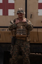 NAVAL STATION GUANTANAMO BAY, Cuba (Aug. 26, 2026) — U.S. Navy Hospital Corpsman 3rd Class Cameron Alexander Clarke, assigned to Joint Task Force-Southern Guard’s Task Force Secure, poses for a photo in front of a tactical medical vehicle at Naval Station Guantanamo Bay, Cuba. Clarke serves as Task Force Secure’s senior line and company corpsman, providing medical care, coordinating treatment and supporting the health and readiness of more than 140 Marines. (U.S. Army photo by Spc. Daymien Robinson)