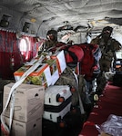 U.S. Army Sgts. Durana Amoncio, left, and Sgt. Mark Bumanglag, right, both CH-47 Chinook crew chiefs assigned to 2nd Battalion, 211th Aviation Regiment, 103rd Troop Command, Hawaii Army National Guard, secures equipment before transport in Kalaeloa, Hawaii, Sept. 5, 2026. In preparation for Hurricane Lowell, the Hawaii National Guard is positioning personnel, equipment and high-wheeled vehicles on Kauai to be ready to respond as requests are received. The Hawaii National Guard is working closely with the Hawaii Emergency Management Agency, county emergency management agencies and other response partners to prepare for the storm. Photo by Staff Sgt. Randall Corpuz.