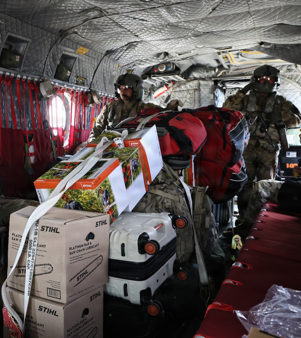 U.S. Army Sgts. Durana Amoncio, left, and Sgt. Mark Bumanglag, right, both CH-47 Chinook crew chiefs assigned to 2nd Battalion, 211th Aviation Regiment, 103rd Troop Command, Hawaii Army National Guard, secures equipment before transport in Kalaeloa, Hawaii, Sept. 5, 2026.