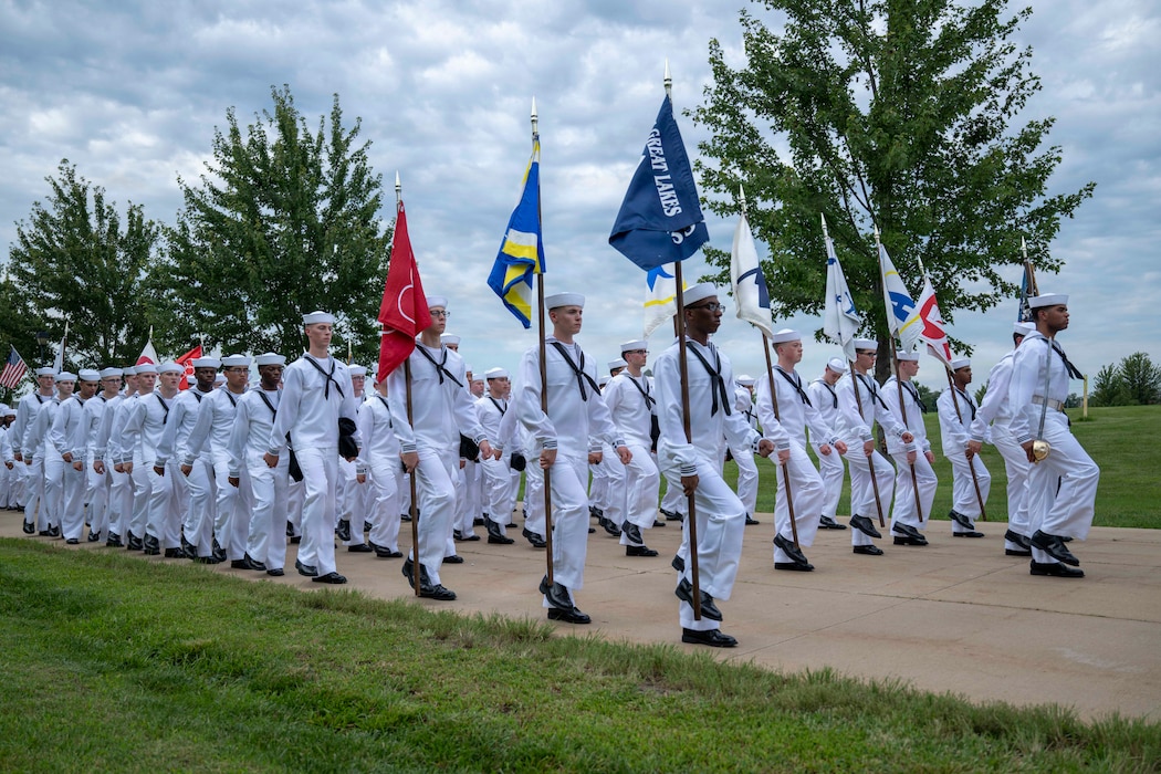 Sailors wait to march into Midway Ceremonial Drill Hall during pass-in-review onboard U.S. Navy Recruit Training Command. Training is approximately nine weeks and all enlistees in the U.S. Navy begin their career at the command. More than 40,000 recruits train annually at the Navy’s only boot camp.