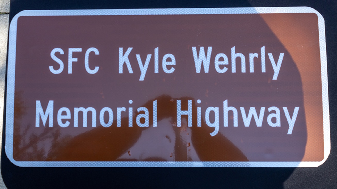 A replica of the Sgt. 1st Class Kyle Wehrly Memorial Highway sign which was presented to family members during a highway dedication ceremony Sept. 4 in Galesburg.