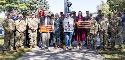 Illinois Army National Guard Soldiers serving in Battery B, 2nd Battalion, 123rd Field Artillery Regiment, shown with Sgt. 1st Class Kyle Wehrly’s family, were in attendance during the highway dedication ceremony honoring Wehrly Sept. 4 in Galesburg.