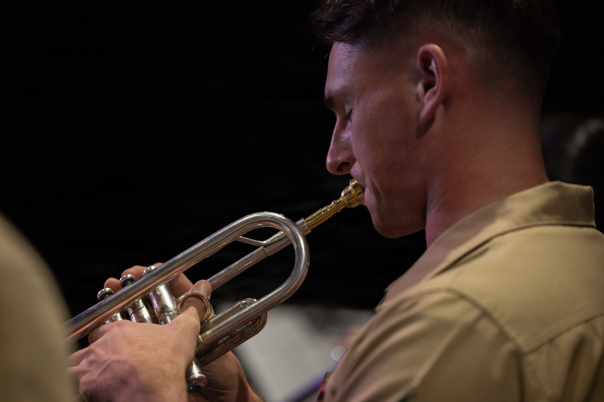 U.S. Marine Corps Cpl. Duncan Lovegrove, a trumpet player with the 1st Marine Division Band performs during a concert at Butterfield Amphitheater in Idyllwild, California, Aug. 20, 2026. The band’s performance at Idyllwild occurs annually as a means of maintaining strong military relations with the community. Lovegrove is a native of Vermont. (U.S. Marine Corps photo by Cpl. Stella Tedesco)