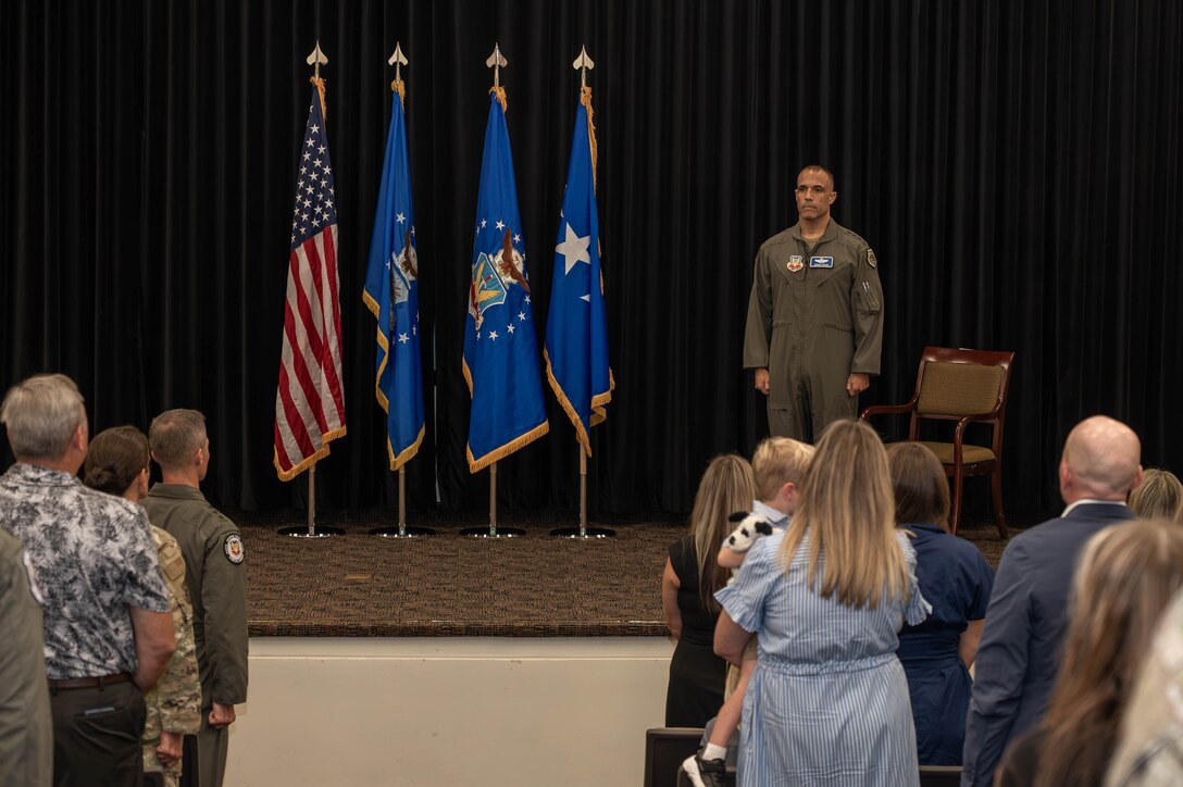 LANGLEY AIR FORCE BASE, Va -- U.S. Air Force Gen. Adrian Spain, commander of Air Combat Command, stands at attention during a Distinguished Flying Cross ceremony at Langley Air Force Base, Virginia, Aug. 31, 2026. The DFC is awarded to any officer or enlisted person of the Armed Forces of the United States for heroism or extraordinary achievement while participating in aerial flight. Both heroism and achievement must be entirely distinctive, involving operations that are not routine. (U.S. Air Force photo by Airman 1st Class Kaden Ciminnisi)