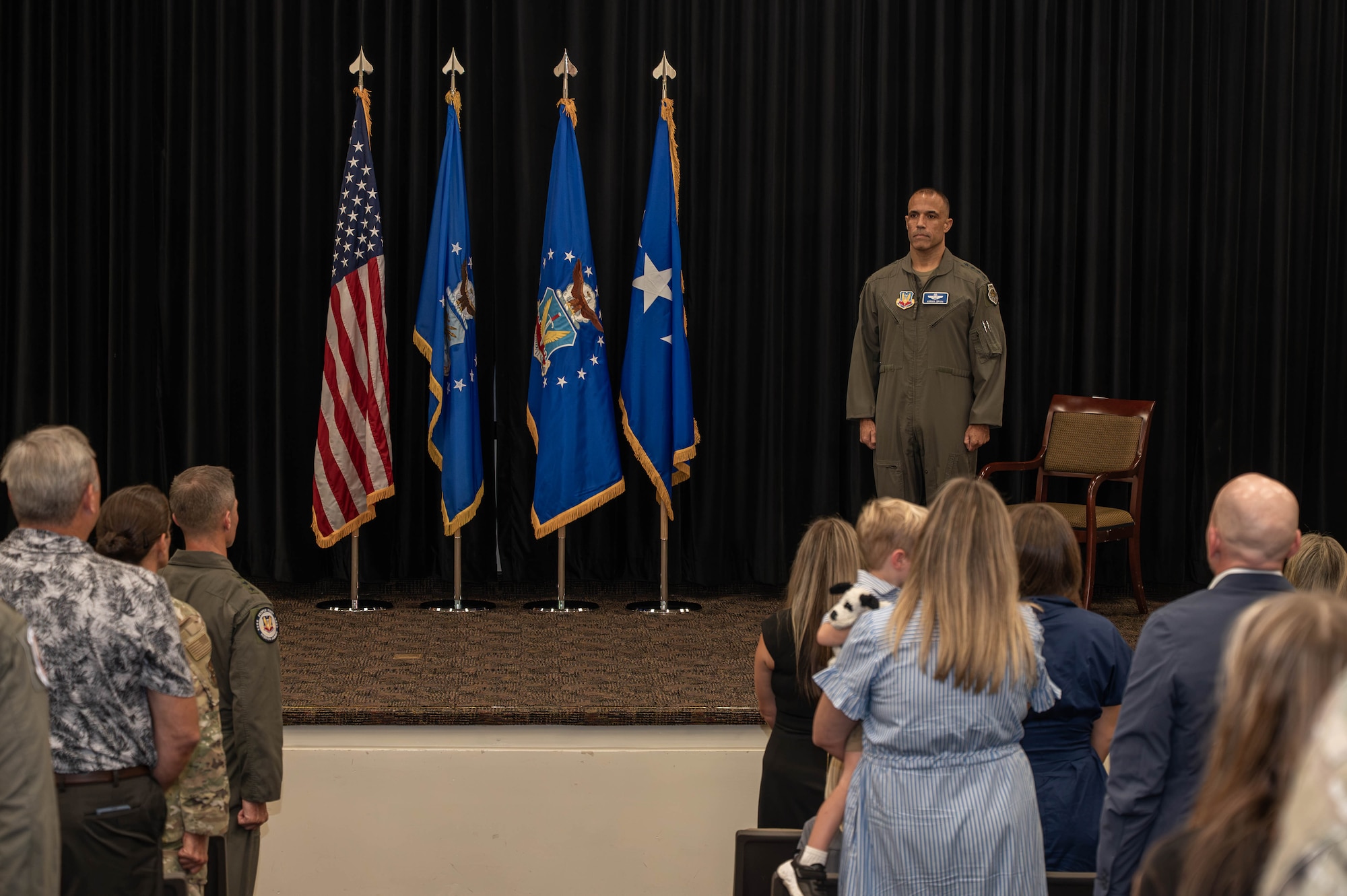 LANGLEY AIR FORCE BASE, Va -- U.S. Air Force Gen. Adrian Spain, commander of Air Combat Command, stands at attention during a Distinguished Flying Cross ceremony at Langley Air Force Base, Virginia, Aug. 31, 2026. The DFC is awarded to any officer or enlisted person of the Armed Forces of the United States for heroism or extraordinary achievement while participating in aerial flight. Both heroism and achievement must be entirely distinctive, involving operations that are not routine. (U.S. Air Force photo by Airman 1st Class Kaden Ciminnisi)