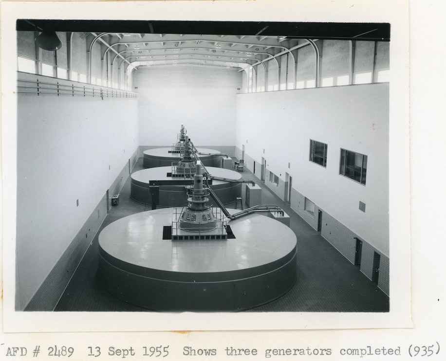 Black and white photo of the three Kaplan hydroelectric generators at Albeni Falls Dam from 1955.