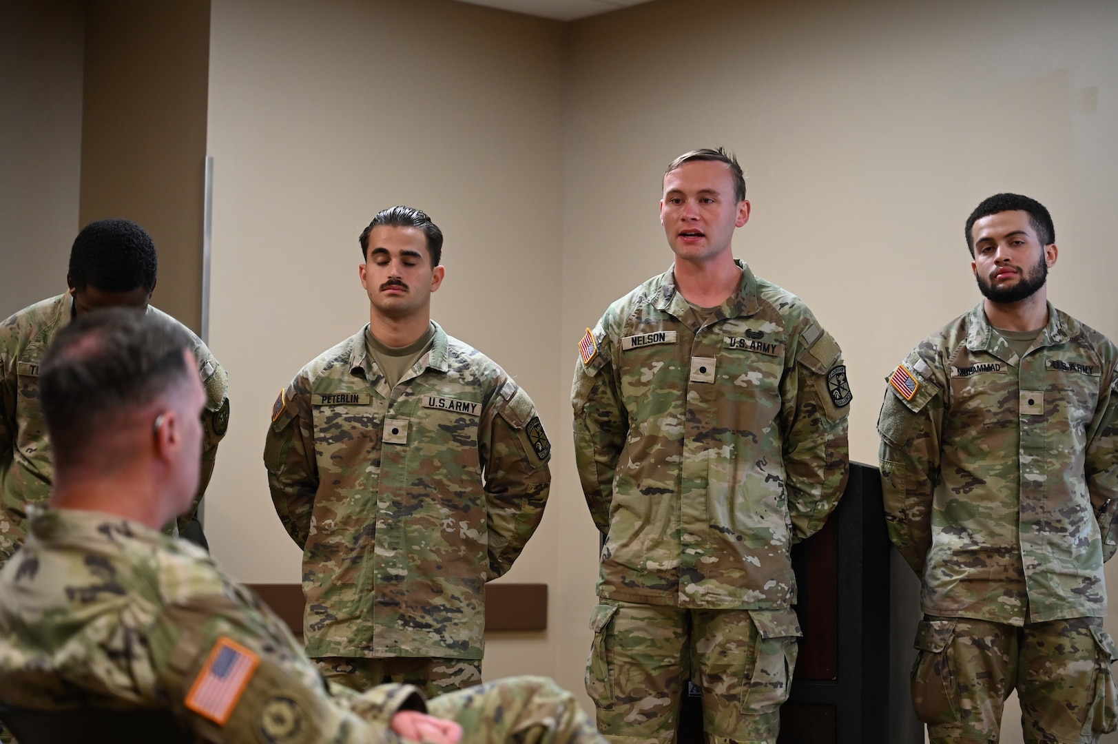 Cadet Alexander Nelson, a nursing student from Marquette University, answers a question during the presentation of the class project during the Nurse Summer Training Program graduation ceremony at Carl R. Darnall Army Medical Center. The project focused on advancing nursing care throughout the hospital.