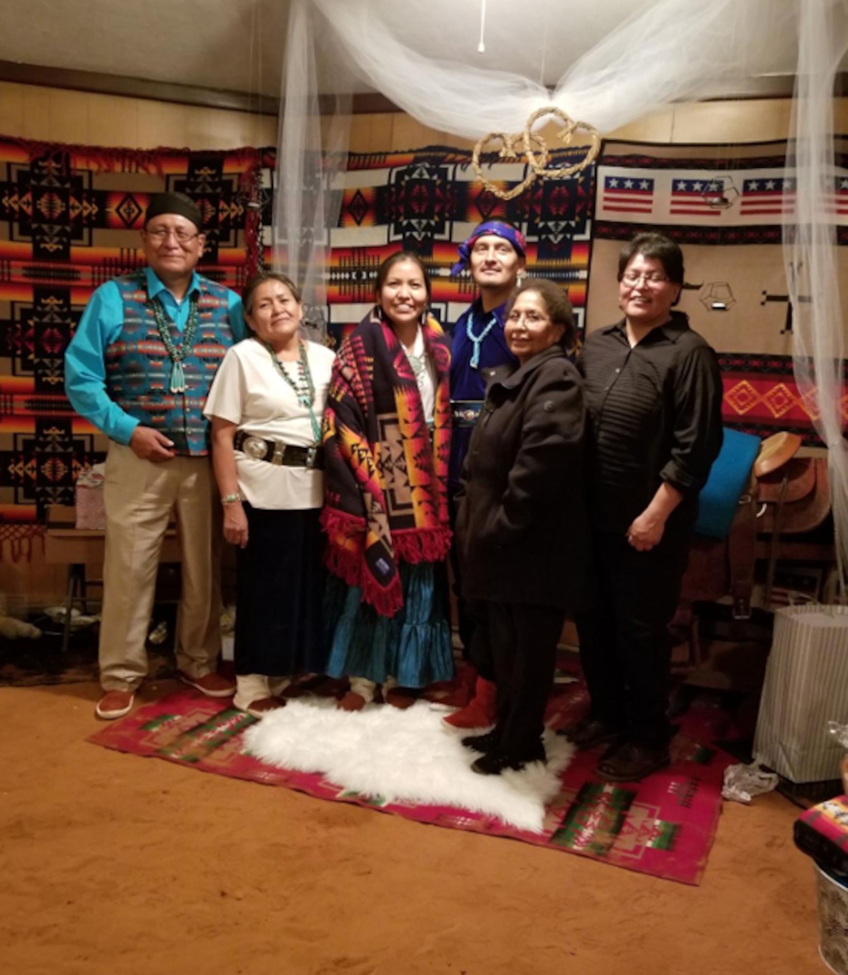 Senior Airman Jared Eugene Wyaco of the 342nd Training Squadron and his family are pictured at a family wedding ceremony on Nov. 10, 2018, in White Clay, Arizona. Wyaco shares his family’s historical ties to World War II to remind fellow Airmen that endurance is rooted in remembering who and what they serve for. (Yazzie, Angelena Wyaco, Jared Wyaco, Florine Beyuka, Tammy Wyaco, White Clay, AZ, November 10, 2018) (Courtesy photo)