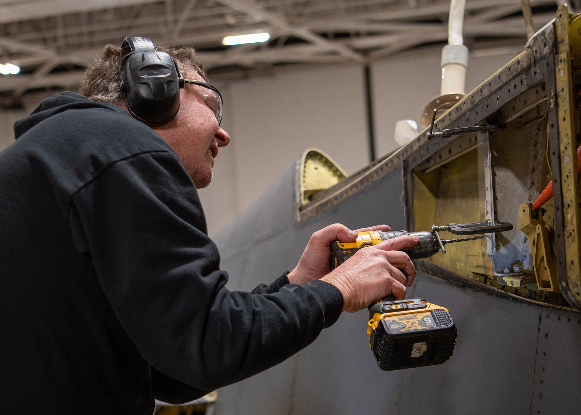 James Shobert performs programmed depot maintenance on a B-1 aircraft at the Oklahoma City Air Logistics Complex at Tinker Air Force Base, Oklahoma, Dec. 4, 2022. The B-1 is receiving upgrades outside of its depot maintenance schedule to enhance its lethality in the future. (U.S. Air Force photo by Carter Denton)