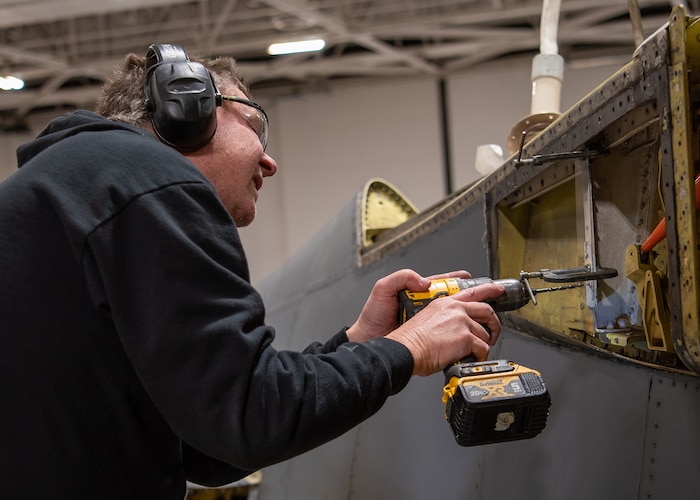 James Shobert performs programmed depot maintenance on a B-1 aircraft at the Oklahoma City Air Logistics Complex at Tinker Air Force Base, Oklahoma, Dec. 4, 2022. The B-1 is receiving upgrades outside of its depot maintenance schedule to enhance its lethality in the future. (U.S. Air Force photo by Carter Denton)