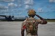 An airman assigned to the 172nd Airlift Wing marshals an aircraft at Karup Air Base, Denmark, June 18, 2026. The wing was recognized as one of 13 military programs for its commitment and innovation in outstanding suicide prevention efforts to save lives during a recognition ceremony at the Pentagon, Sept. 2, 2026.