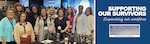 Ten women pose for a photo while at a training session.
