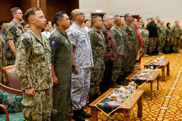 U.S. Navy Capt. Robert Reyes, second from left, mission commander of Pacific Partnership 2026 (PP26), stands at attention for the national anthem alongside leaders of PP26, U.S. Embassy Kuala Lumpur and the Malaysian Armed Forces during the PP26 Malaysia mission stop opening ceremony in Kota Kinabalu, Malaysia, Sept. 3, 2026. Now in its 22nd iteration, the Pacific Partnership series is the largest annual multinational humanitarian assistance and disaster management preparedness mission conducted in the region. Pacific Partnership works collaboratively with host and partner nations to enhance regional interoperability and disaster response capabilities, increase security in the region, and foster new and enduring friendships in the Indo-Pacific. (U.S. Navy photo by Mass Communication Specialist 1st Class Justin E. Yarborough)