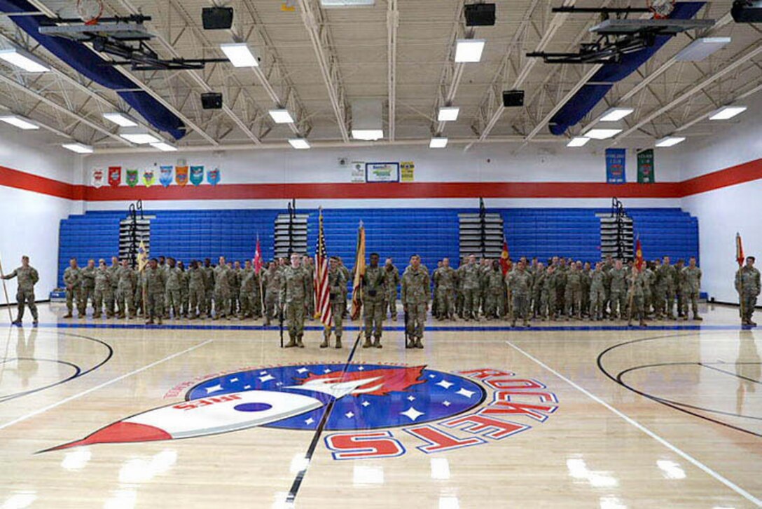 A color guard detail assigned to the 1792nd Combat Sustainment Support Battalion stands in front of formation with the national and unit colors during a change of command ceremony at Jody Richards Elementary School in Bowling Green, Kentucky, Aug. 23, 2026.