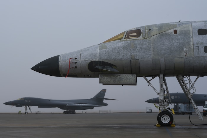 Three Boeing B-1B Lancer aircraft undergoing maintenance, repair and overhaul at the Oklahoma City Air Logistics Complex, are shown in foggy conditions during the morning of Feb. 14, 2018, Tinker Air Force Base, Oklahoma. OC-ALC is a subordinate unit of the Air Force Sustainment Center and is the complex responsible for bomber, tanker and jet engine maintenance. (U.S. Air Force photo/Greg L. Davis)